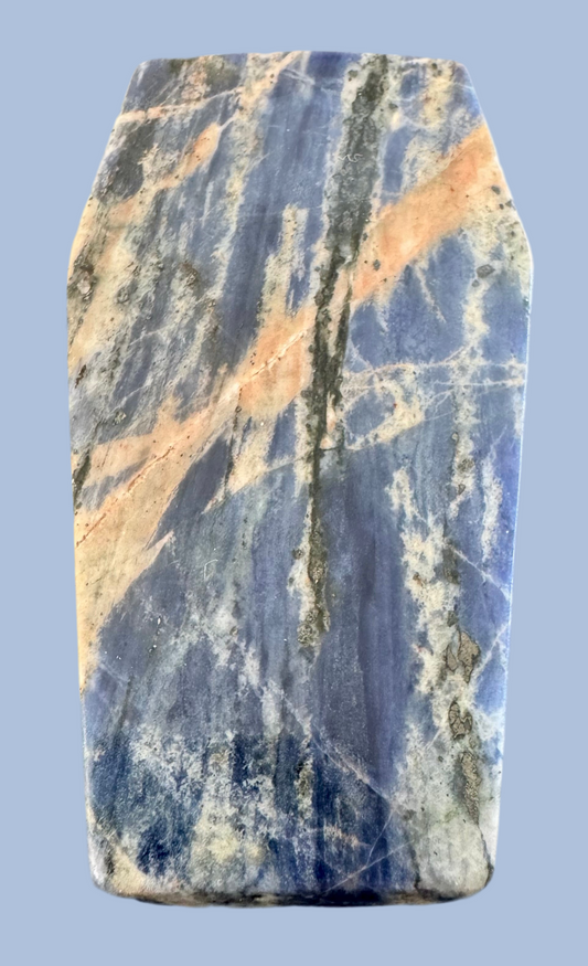 Blue sodalite stone slab with tan and gray streaks.