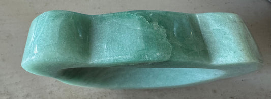 Green carved stone bracelet.