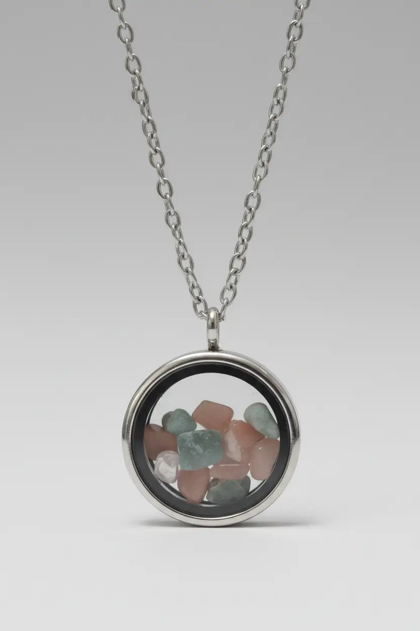 Round silver necklace with pastel-colored gemstones.