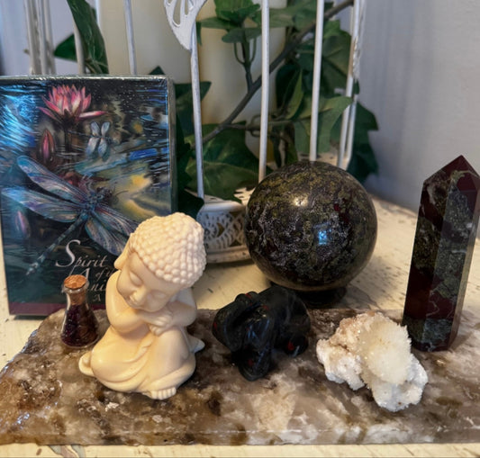 Decorative setup with Dragons Blood Crystals Raw Specimen Buddha Statue Elephant Agate Slab