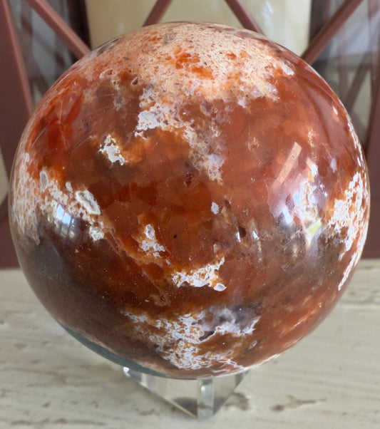 Close up of Brecciated Jasper Apatite Sphere beautiful orange colors