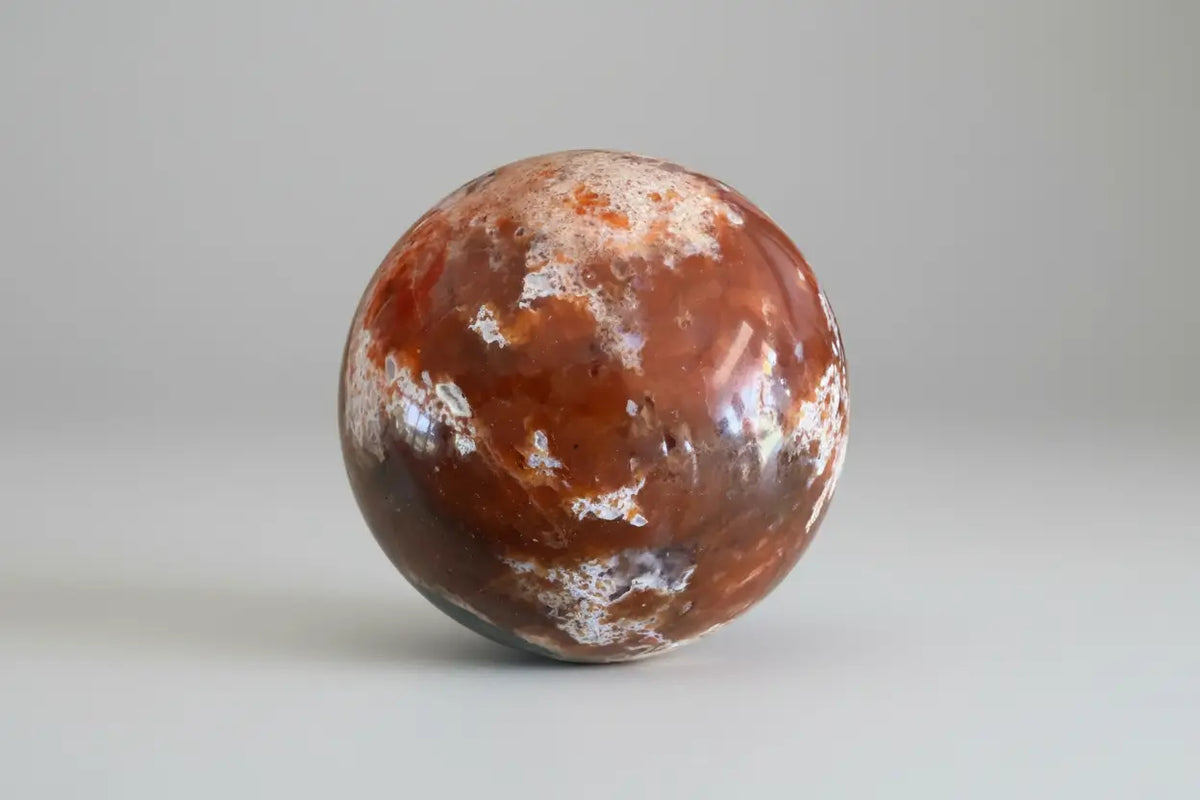 Brecciated Jasper Apatite sphere with orange crystal colors
