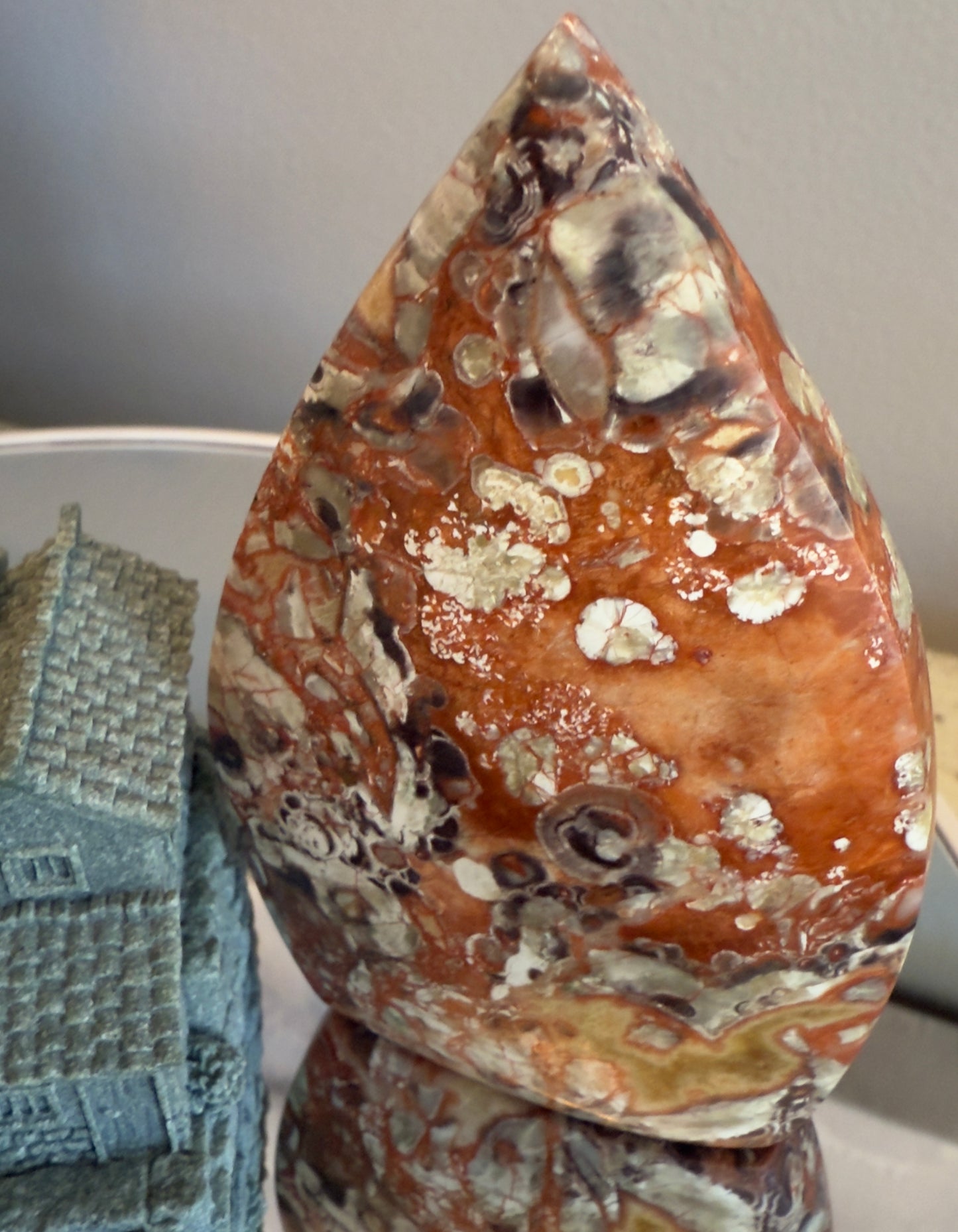 Money Agate teardrop freeform crystal showing intricate red cascade patterns for emotional balance and prosperity