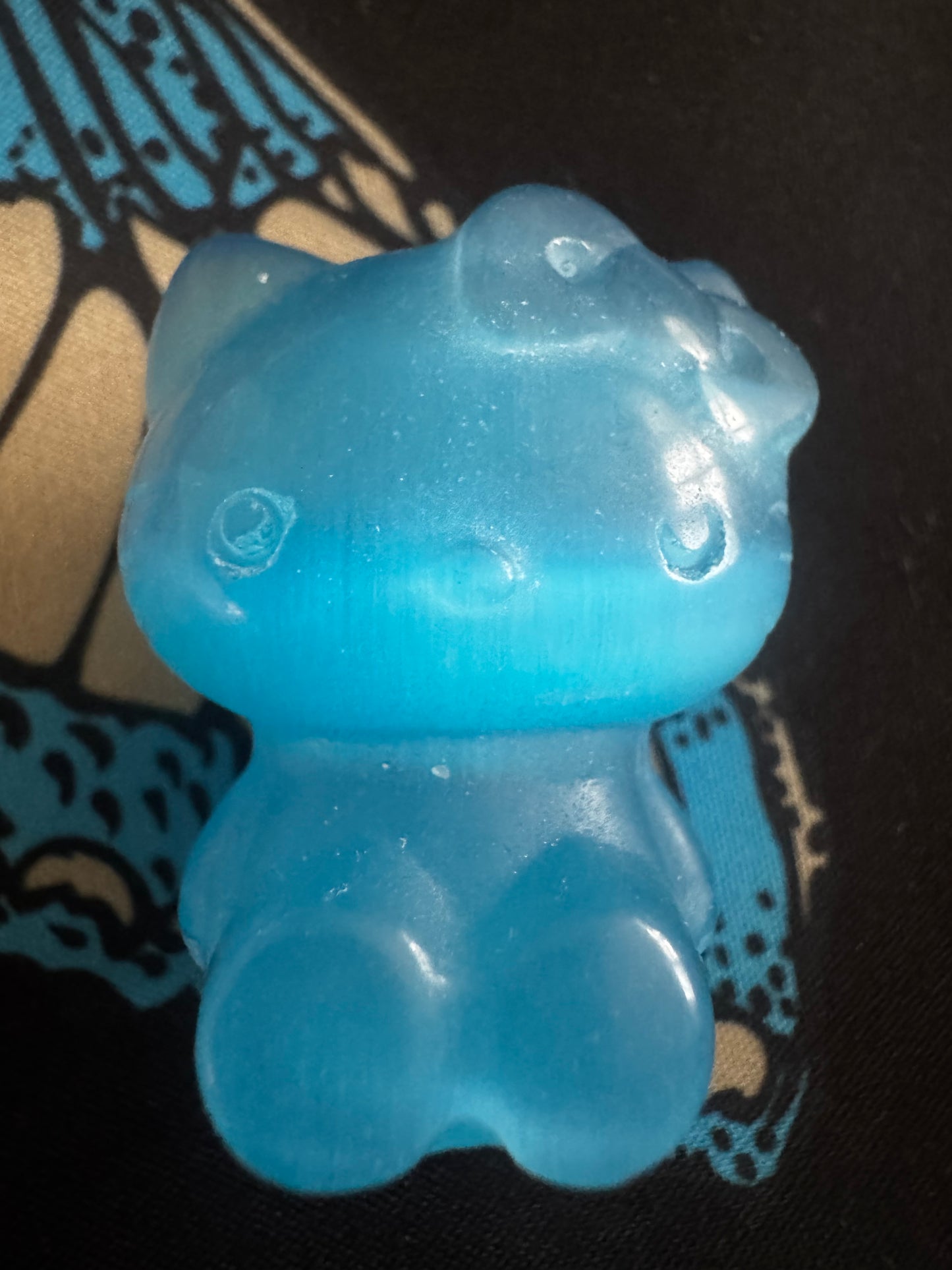 Blue, translucent Hello Kitty shaped soap.