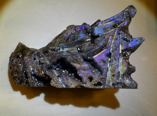 Iridescent bismuth crystal chunk with unique texture and coloration.