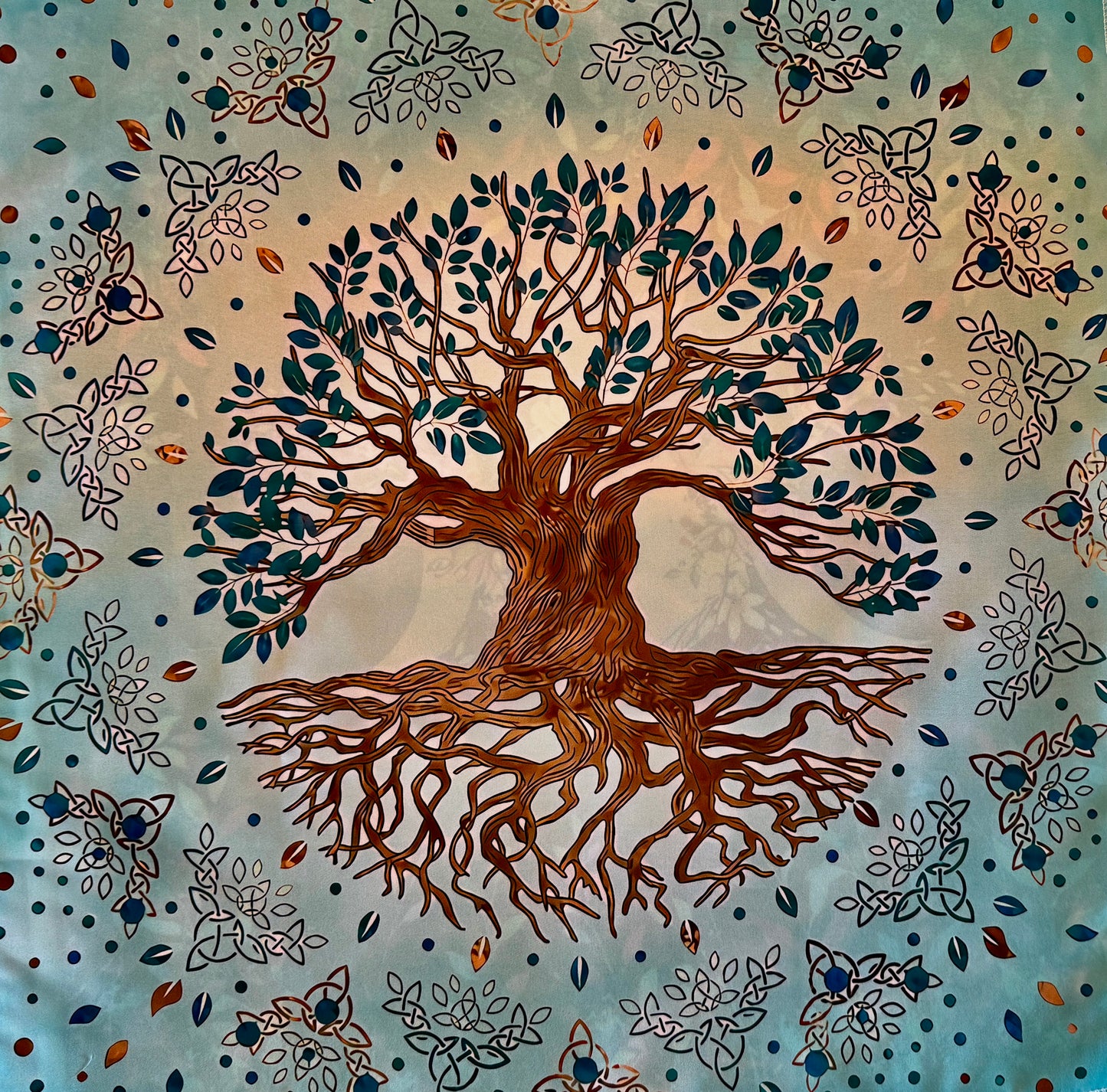 Fabric wall hanging with tree of life motif, celtic knots, blue and brown.