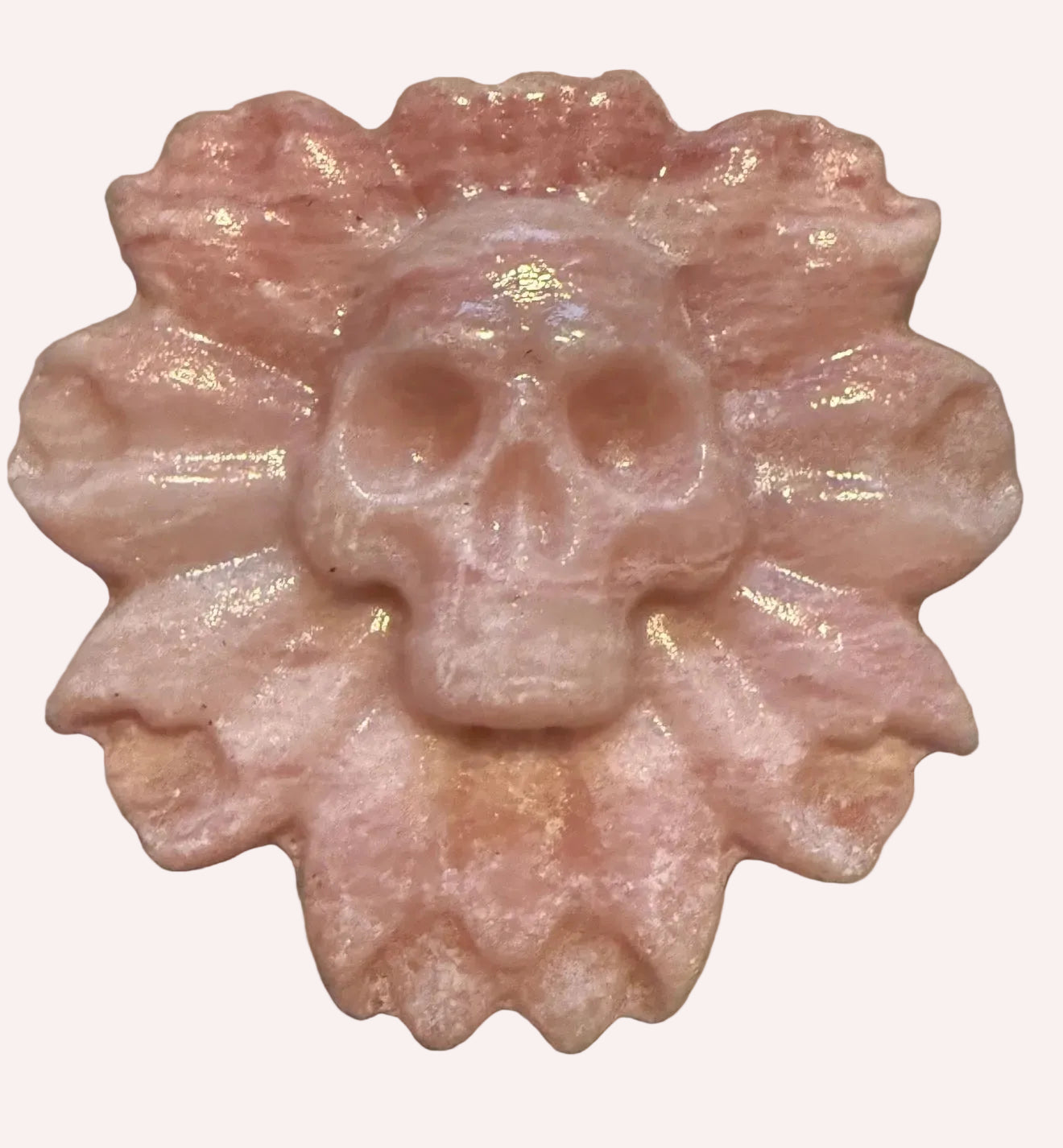 pink calcite polished hand carved skull on flower
