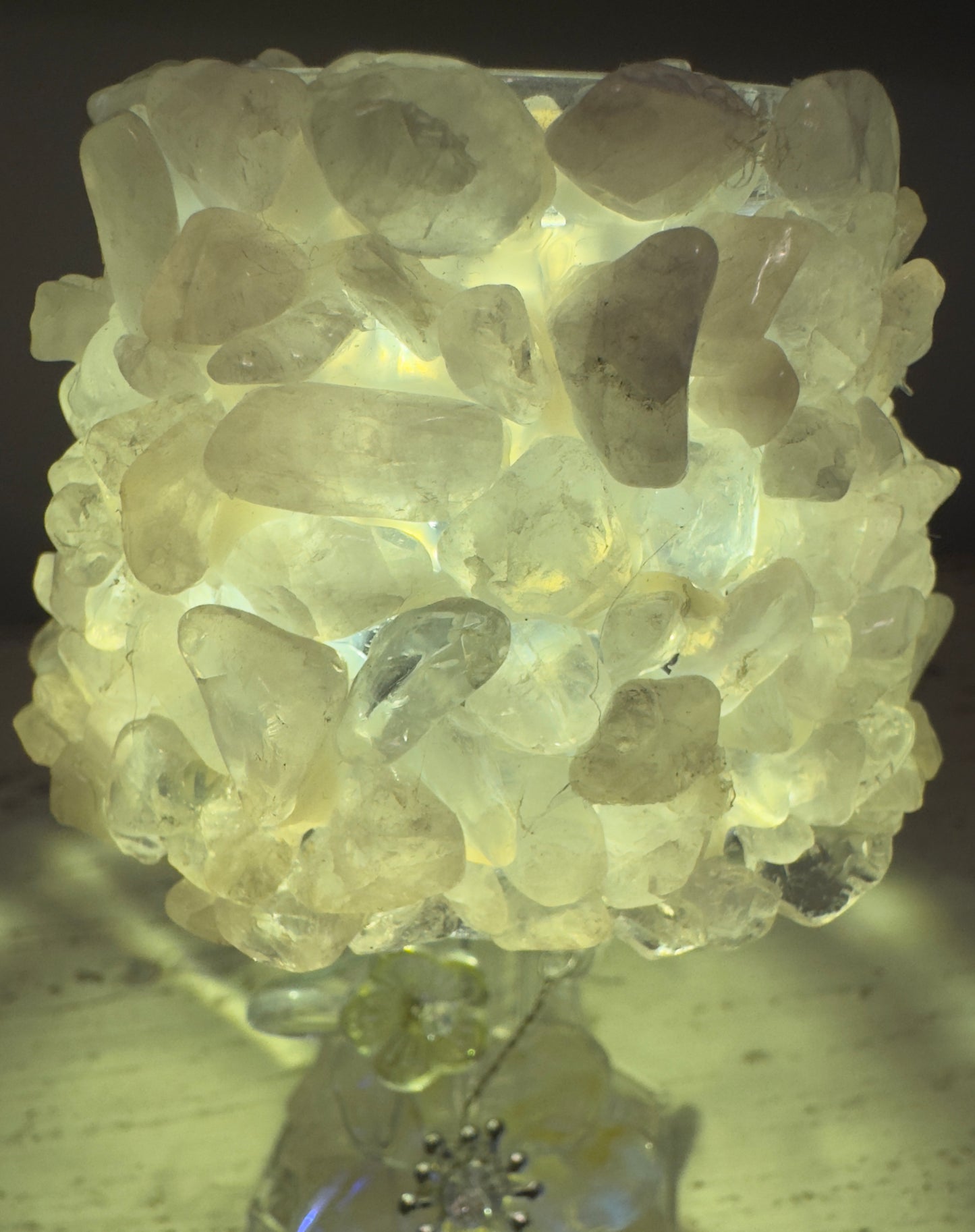 Lamp covered in translucent stones.