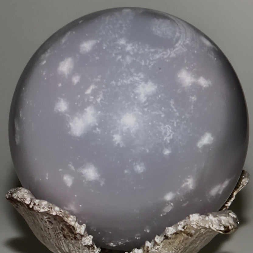 gray crystal sphere with white snowflakes
