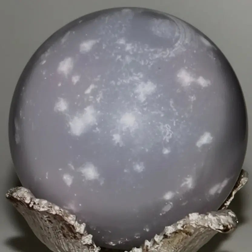 gray crystal sphere with white snowflakes