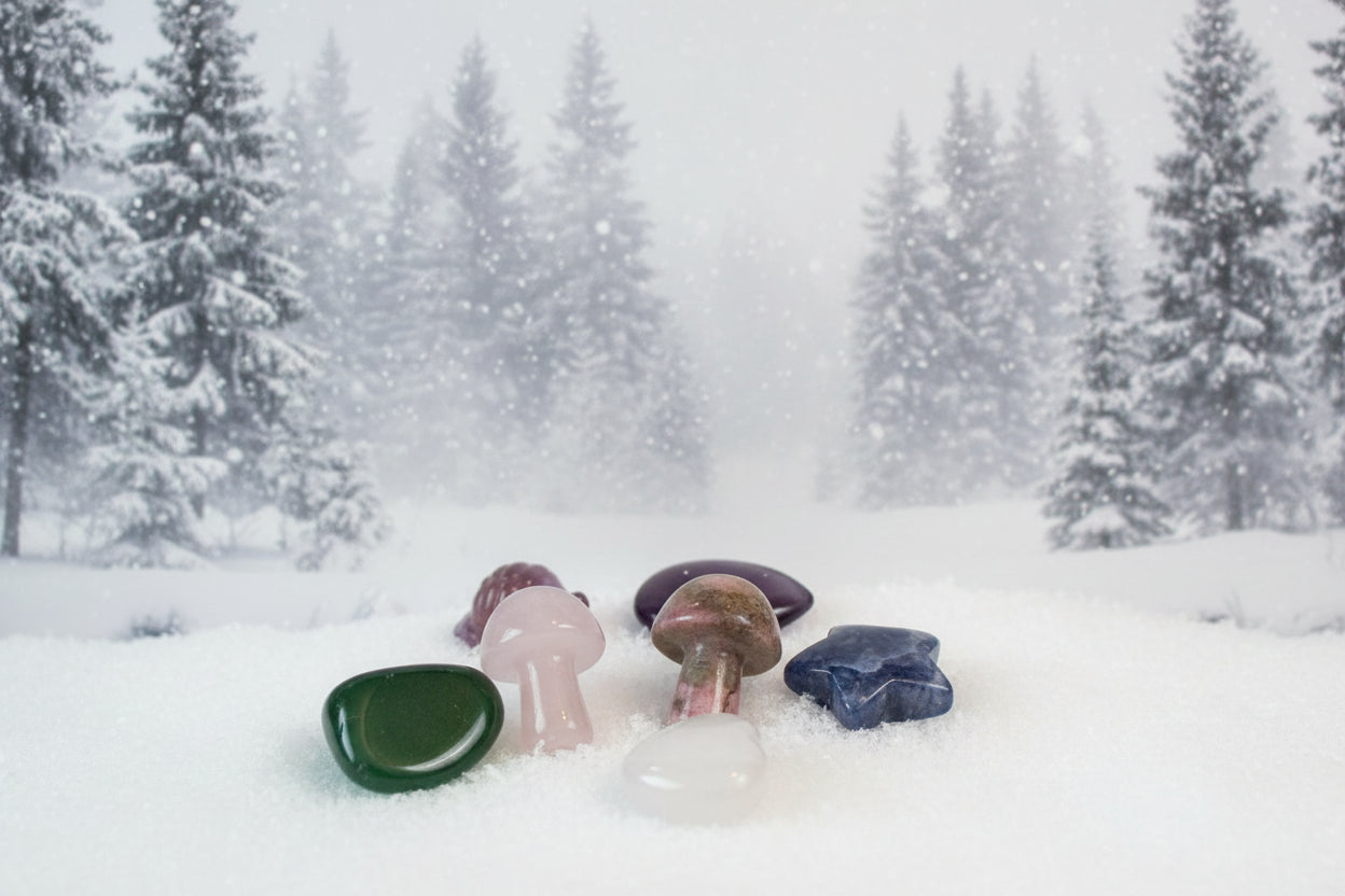 Assorted small crystals in assorted shapes. Background is snow forest