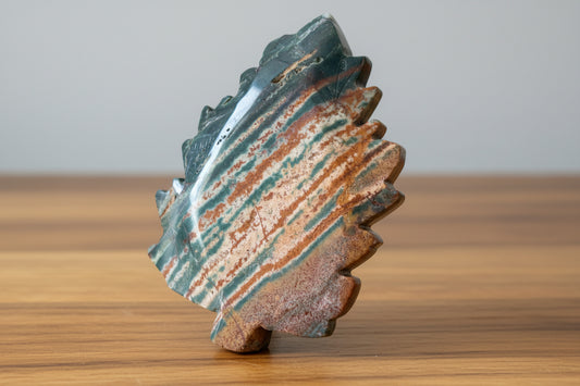 Green Jasper trinket dish colors deep green, rust orange, some peach, hand carved into a leaf