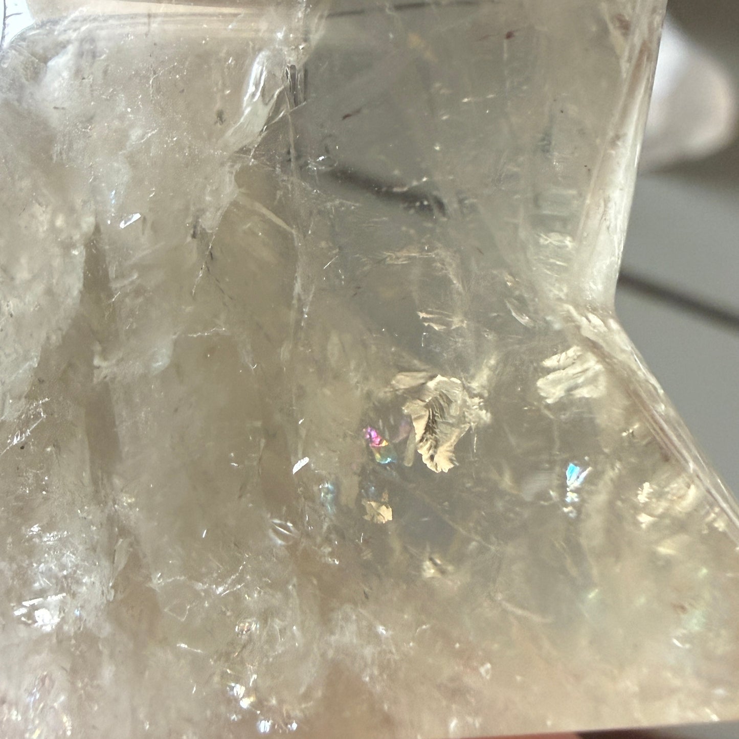close up of high quality citrine carved star with rainbows