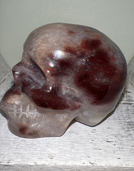 Agate skull with Red Jasper crystal carving side view