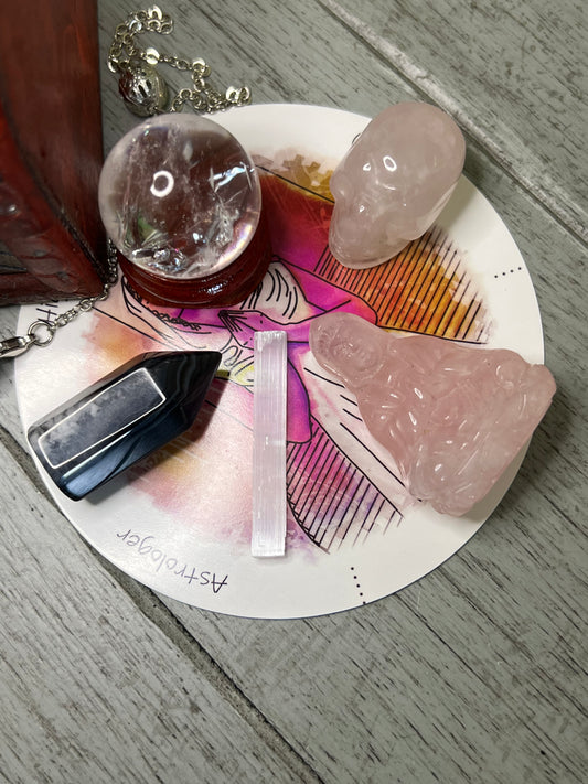 Overhead shot of assorted crystals on an astrologer's plate.