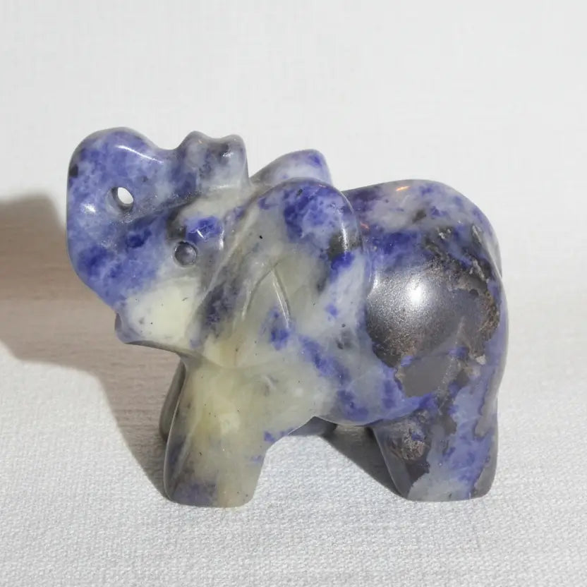 lapis lazuli carving of an elephant with his trunk up for good luck
