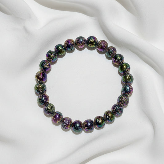looking down at a rainbow aura bead bracelet 9mm beads beautiful vibrant colors