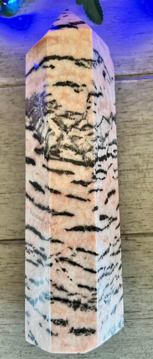 Tigereye-patterned crystal point.