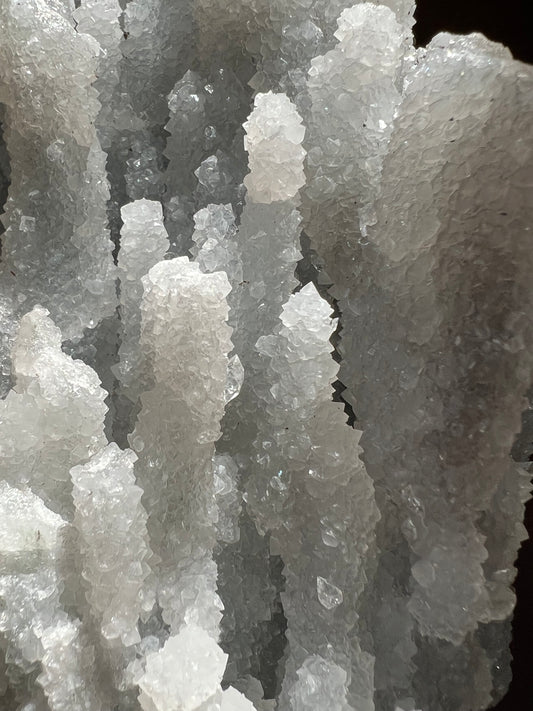 Close-up of a cluster of translucent, crystalline mineral formations.