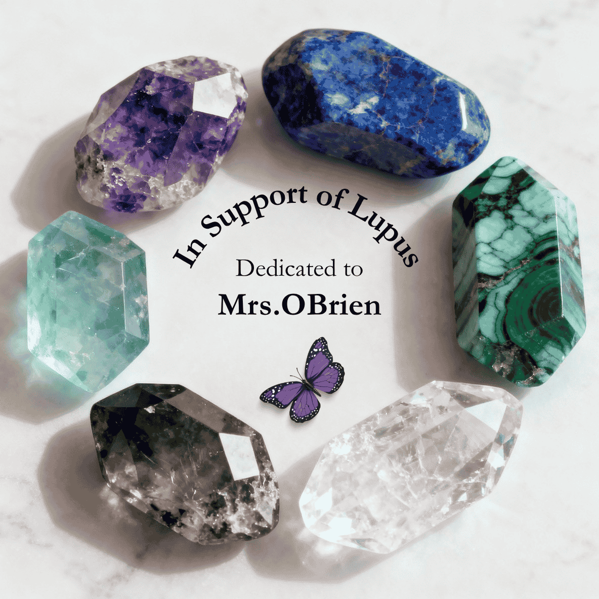 Circle of assorted colors and types of crystal stones with text In Support of Lupus. Dedicated to Mrs. OBrien