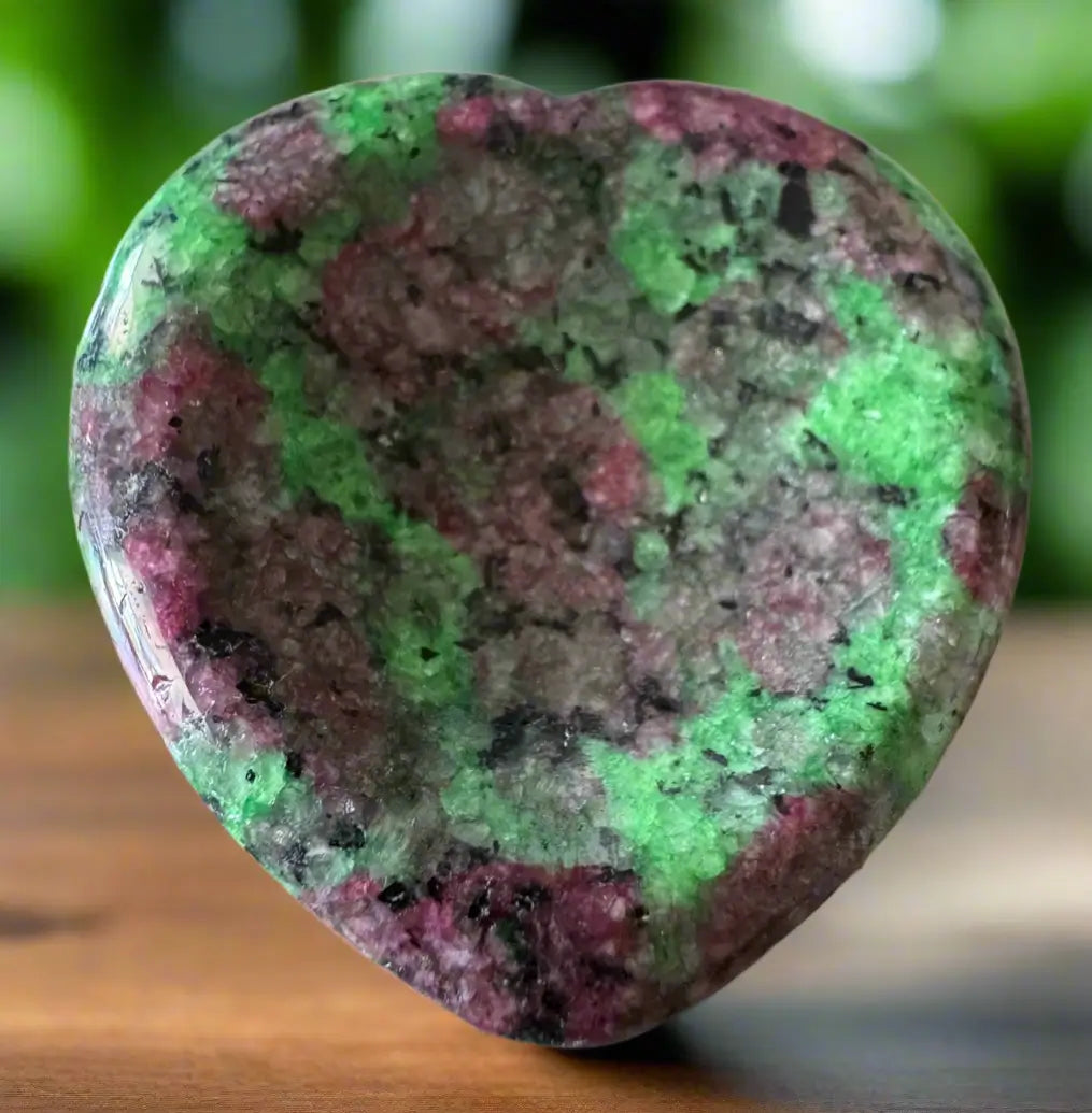 Heart-shaped ruby in zoisite stone with green and red blotches.
