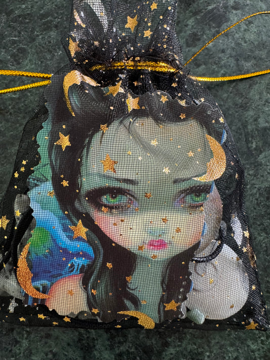 Black mesh drawstring bag with gold stars and moons, cartoon face, and gold drawstring.