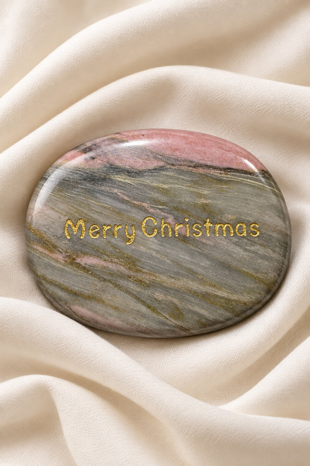 worry stone with Merry Christmas etched on one side in a gold tone.  Rhodonite crystal