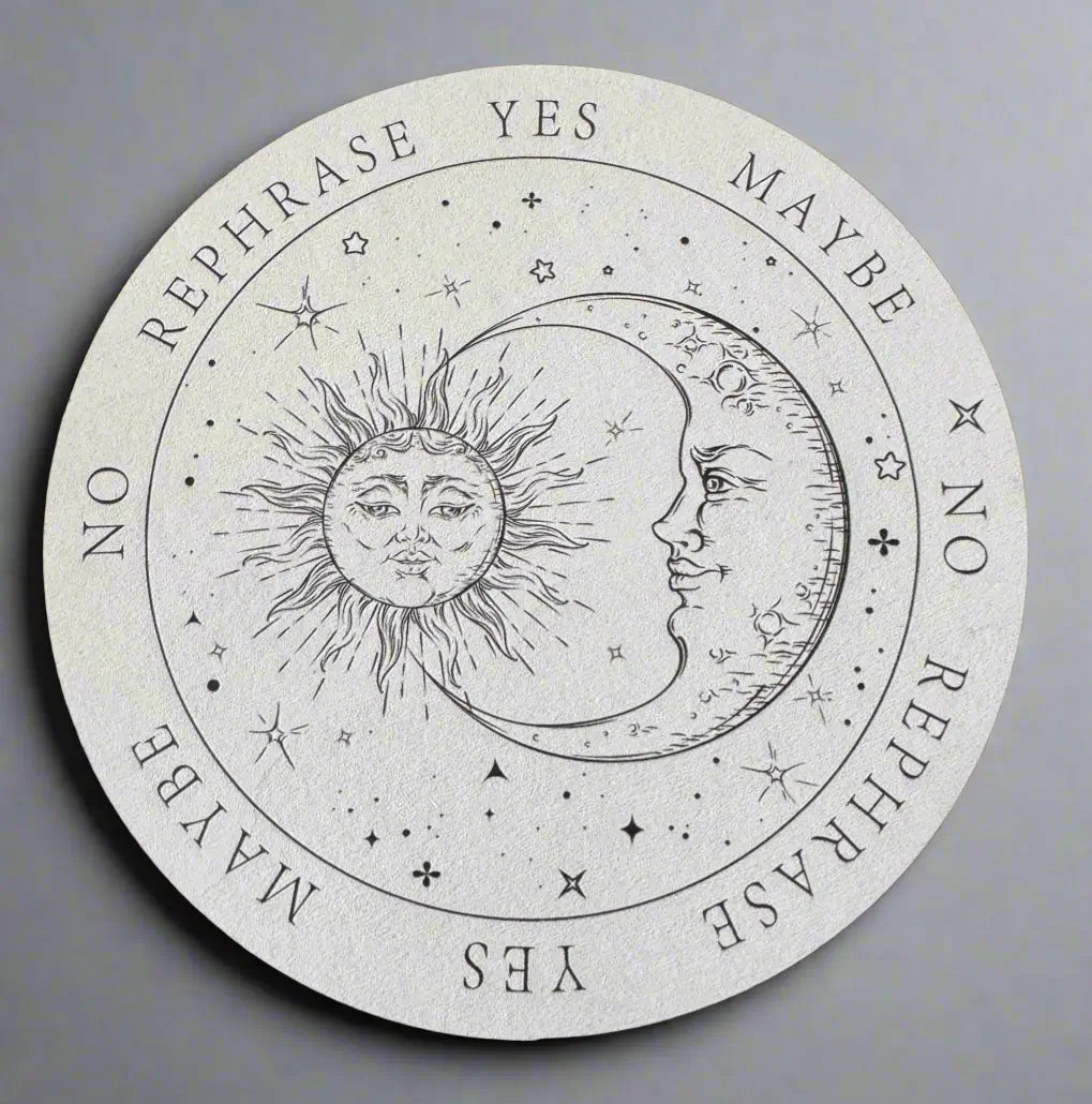 Round pendulum board featuring a sun and moon design with the words "Yes", "No", "Maybe", and "Rephrase".