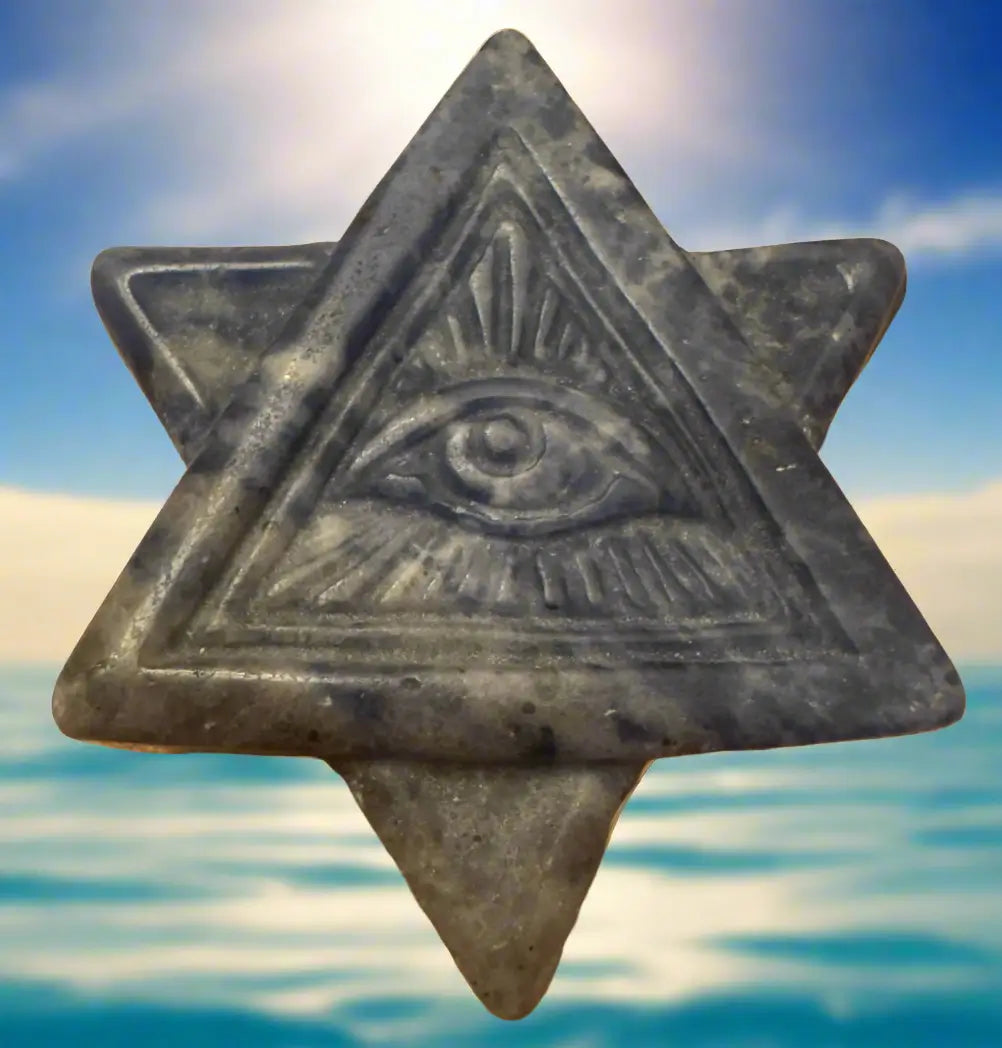 Stone Star of David with eye in pyramid.