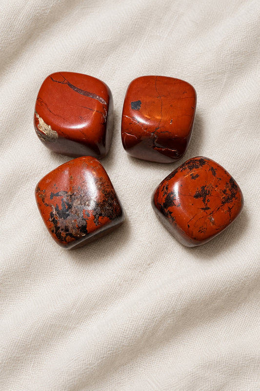 close up photo four cubes, carved brecciated jasper crystal