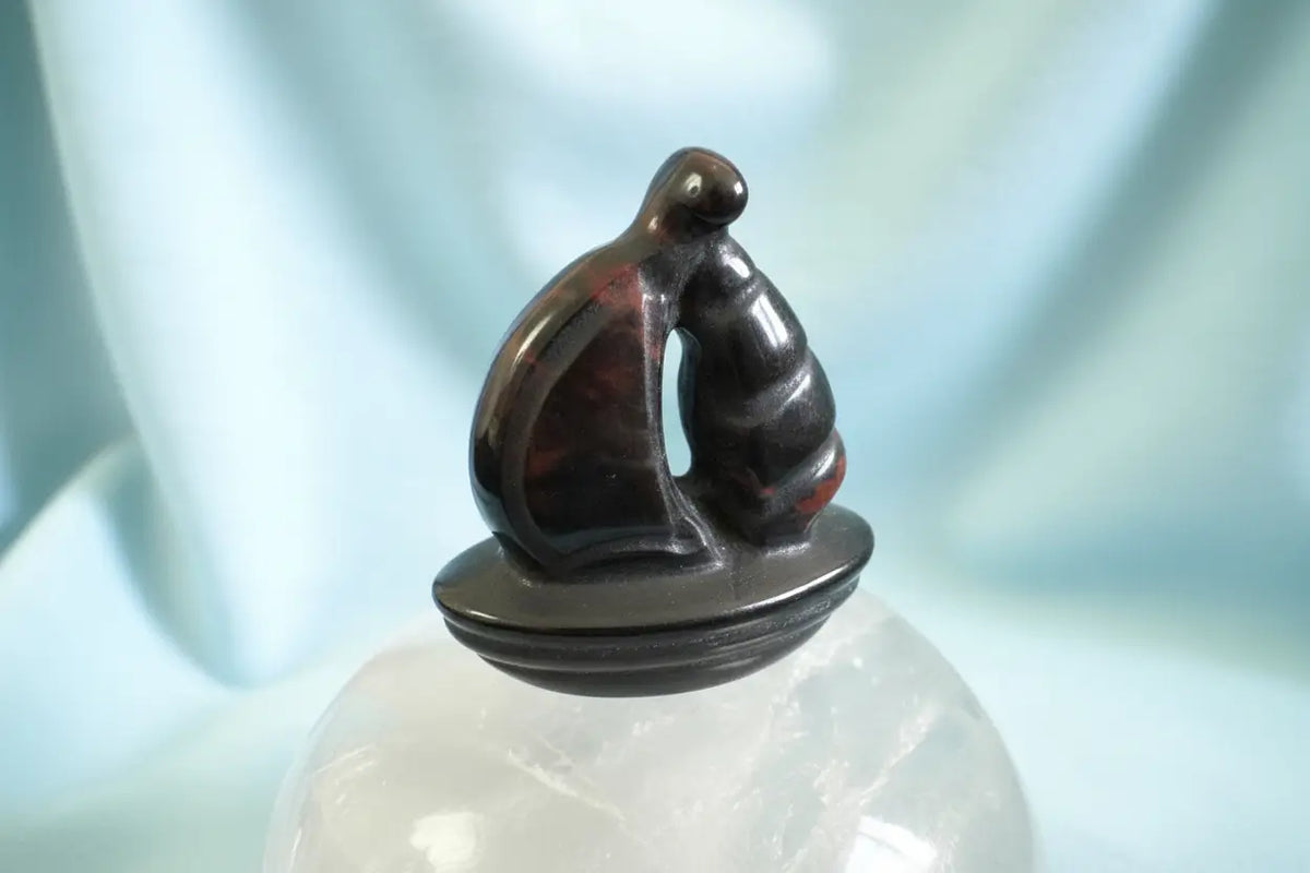 Crystal sailboat carving set with black cat figurine