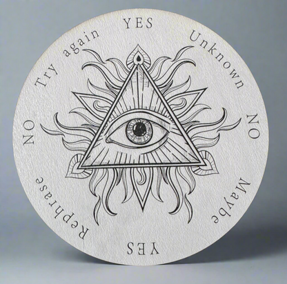 Ouija board with "eye of providence" symbol and "yes", "no", "maybe", "unknown", "try again", and "rephrase" answers.
