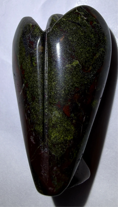 photo back side of dragon’s bloodstone hand carved angel. deep greens and reds 