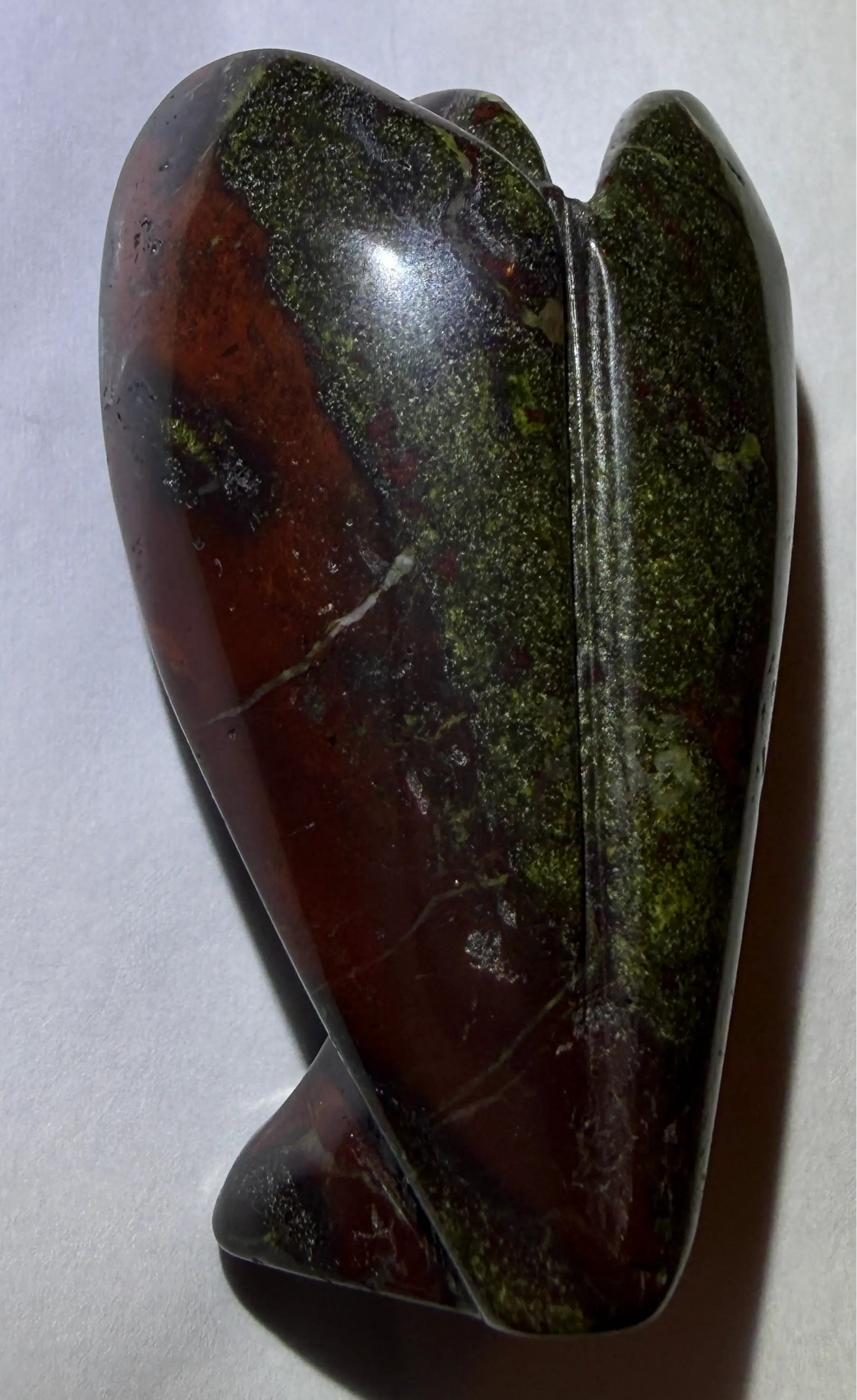 photo of back side natural dragon’s bloodstone hand carved crystal