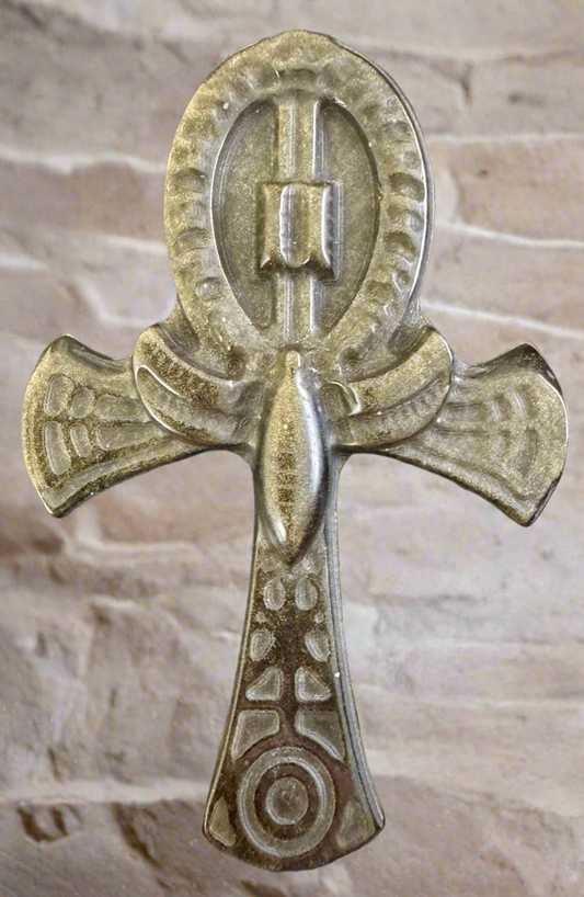 A tarnished metal Egyptian Ankh.