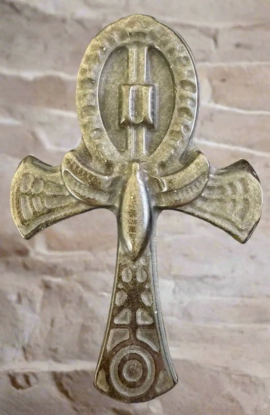 A tarnished metal Egyptian Ankh.