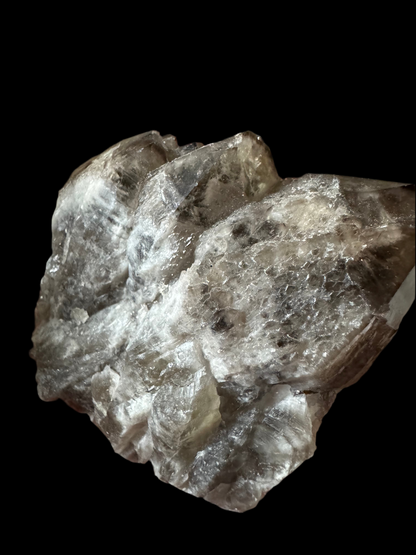 Rough, translucent gray mineral specimen.