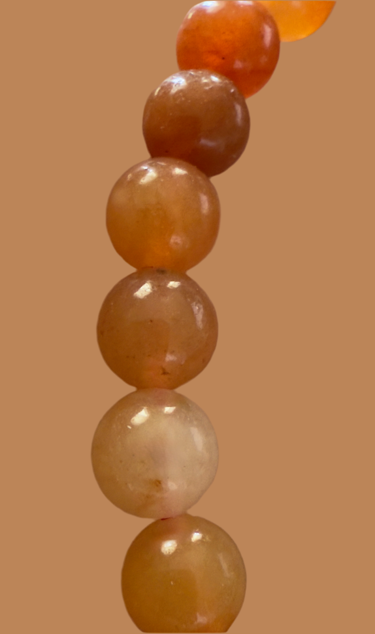 Orange beads in a row.

