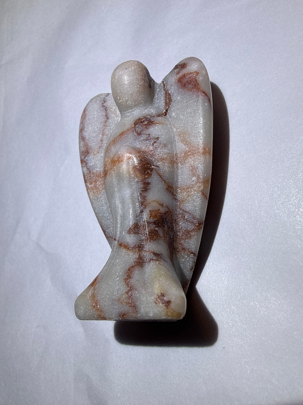 photo of side red vein jasper carved angel 