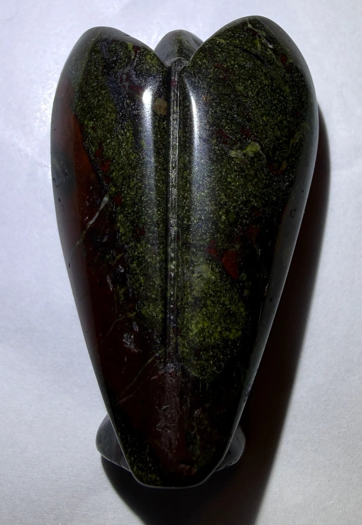 photo of back of dragon’s bloodstone hand carved angel 