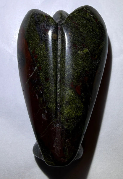 photo of back of dragon’s bloodstone hand carved angel 