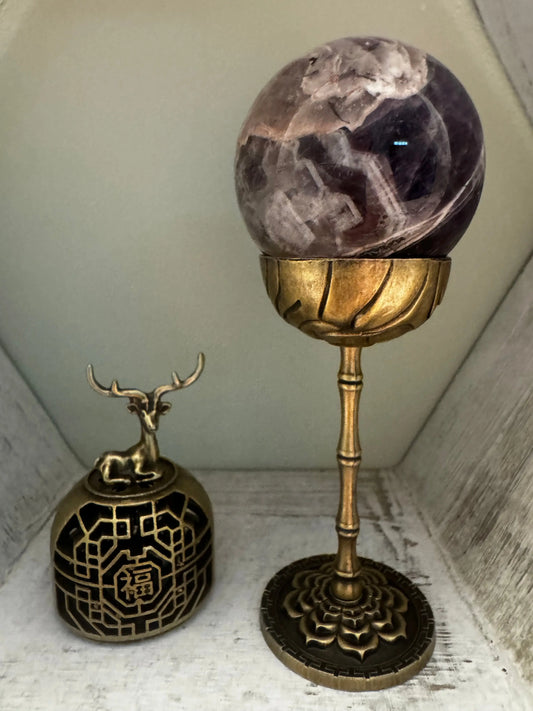 Black and gold elk brass incense holder side view