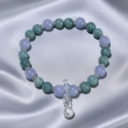 A beaded stretch bracelet featuring alternating Agelite and Aventurine 