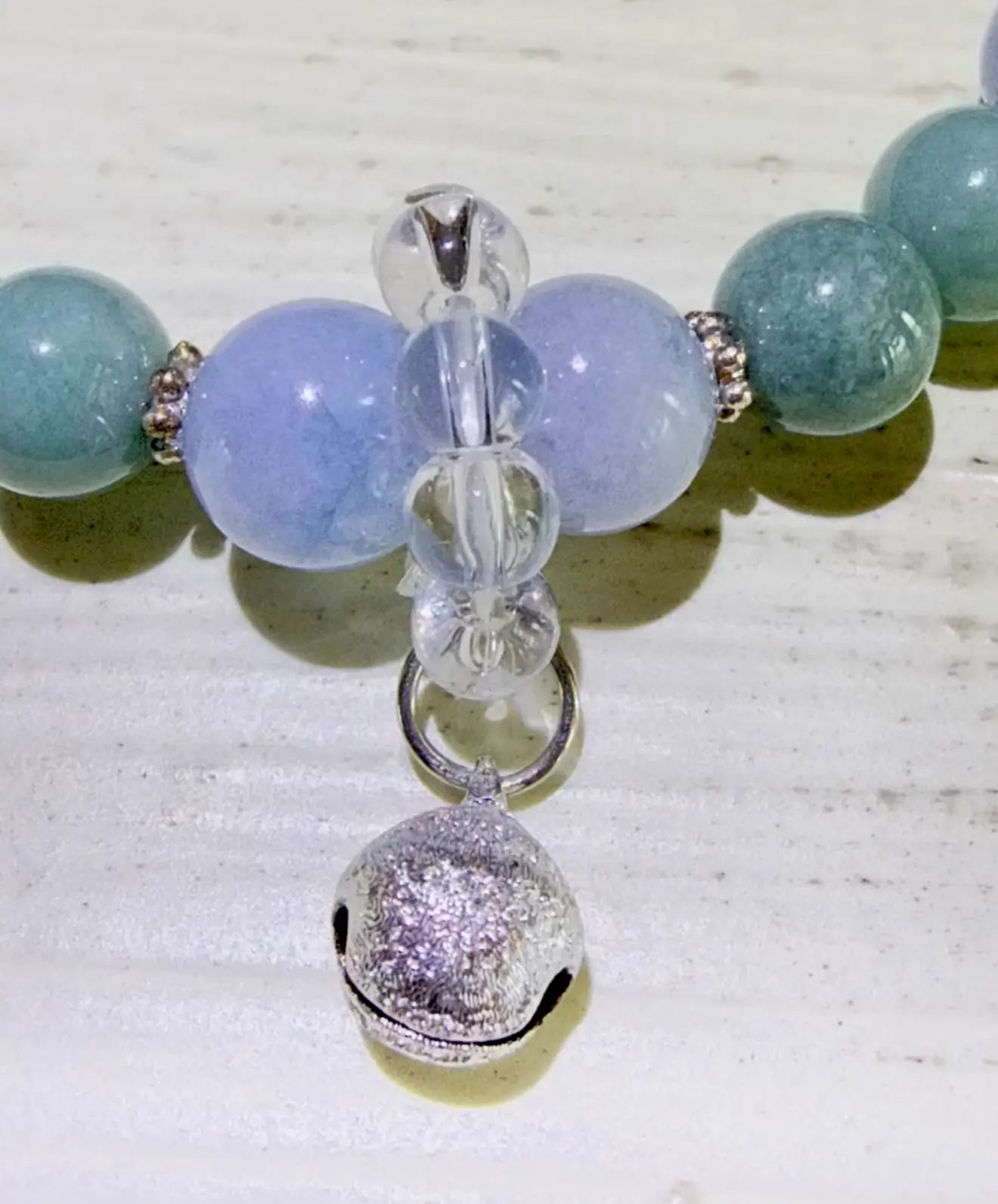 Close up photo of an Angelite Bead, Aventurine Bead and Clear Quartz Bead bracelet