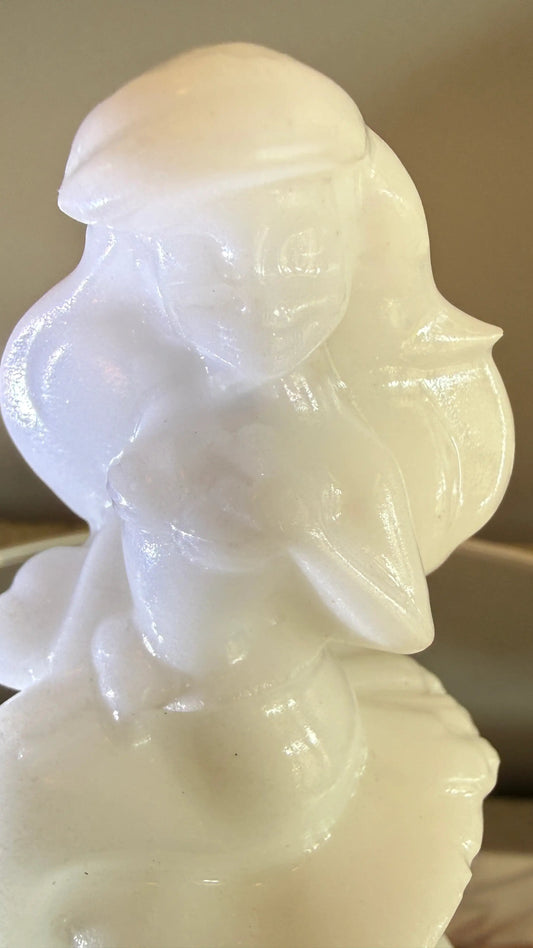 close up hand carved Ariel Mermaid carving/figurine statue. pure white calcite crystal. 
