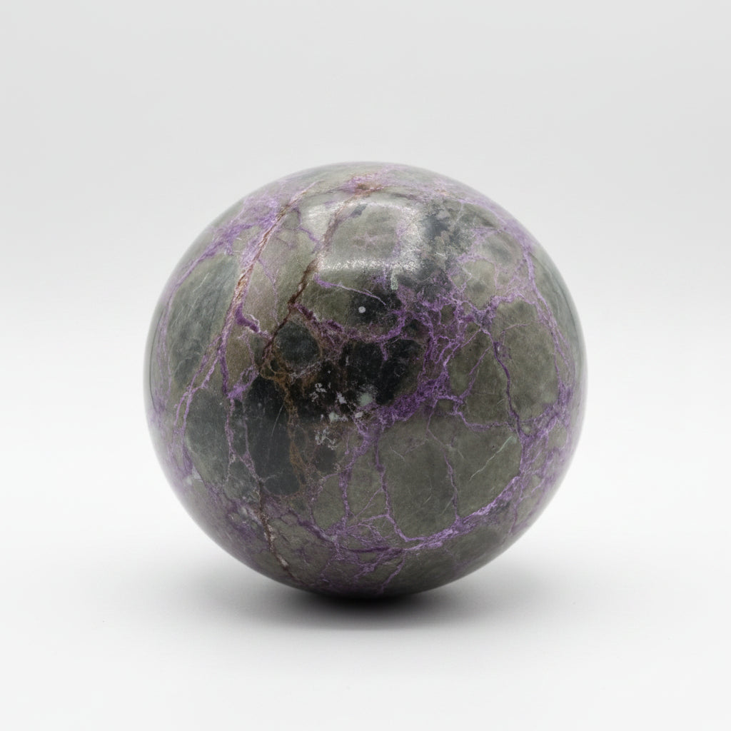 Atlantisite sphere white background brilliant purples and green 