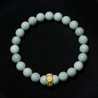 A beaded bracelet made of Aventurine  round beads with a small gold-toned decorative charm at the center, 8mm beads