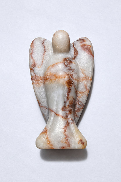 photo of red vein jasper hand carved angel on a white background