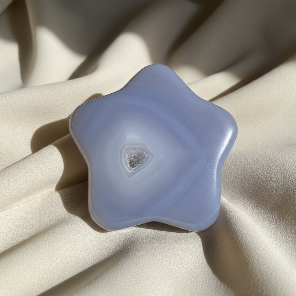 Pretty blue agate carved star thick and has druzy pocket slight banding