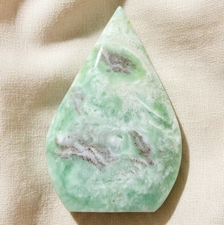 Tear Drop freeform shape Caribbean calcite Beautiful ocean greens, bands of Aragonite and druzy pockets